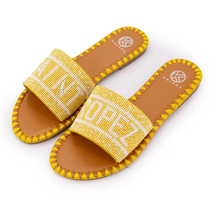 KELARA Mules avec bride à perles inscription saint tropez Femme JAUNE Hot